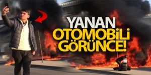 Yanan otomobili arkasına alıp selfie çekti